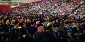 Group of heritage alumni sitting during graduation ceremony