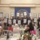 Students holding numbers revealing amount raised at event
