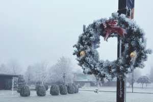 A wreath on a pole in the snow