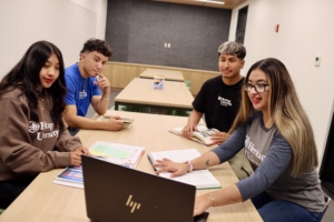 A group of people sitting around a table