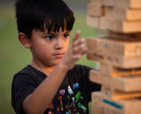 HeritageRiseUp-EW-15 A child playing with blocks