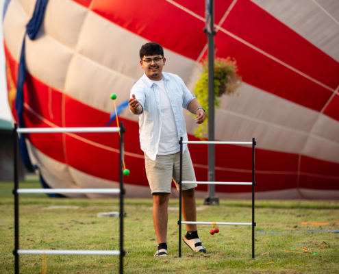 HeritageRiseUp-EW-18 A person standing in front of a hot air balloon
