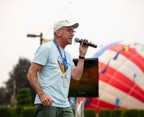 HeritageRiseUp-EW-26 A person speaking into a microphone