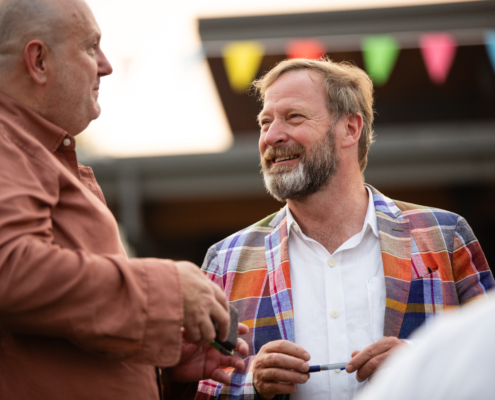 HeritageRiseUp-EW-30 A person talking to another person