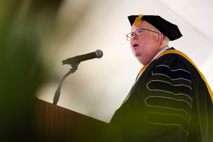 Presidential Inauguration: Installation A person in graduation gown and cap speaking into a microphone