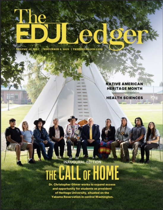 Screenshot A magazine cover with a group of people sitting on chairs in front of a tipi