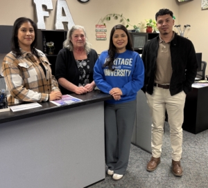 A group of people standing in a room.