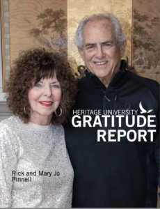 Photograph of an older couple, Rick and Mary Jo Pinnell, smiling and standing close together in front of a decorative wooden panel. Text overlay reads