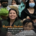 Photograph of a group of students and an educational leader holding stuffed animals, with text overlay highlighting Violet Lumely Rau as a 2026 Heritage alumna and champion for migrant students. The image emphasizes inspiration and support for students to stay in school and reach their full potential.