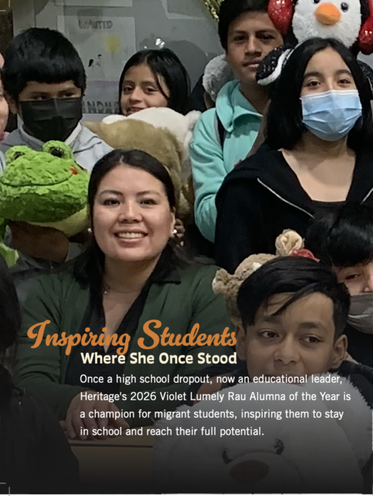 Photograph of a group of students and an educational leader holding stuffed animals, with text overlay highlighting Violet Lumely Rau as a 2026 Heritage alumna and champion for migrant students. The image emphasizes inspiration and support for students to stay in school and reach their full potential.