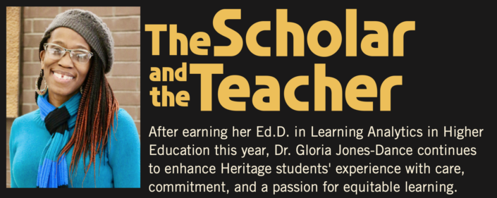 Photograph of a smiling woman wearing glasses, a gray knit hat, and a blue sweater, accompanied by a text block titled "The Scholar and the Teacher." Text highlights Dr. Gloria Jones-Dance's achievement of earning an Ed.D. in Learning Analytics in Higher Education and her dedication to enhancing Heritage students' learning experience with care and commitment.